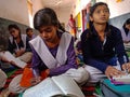 indian government school female students writing on notebook into the classroom in india January 2020 Royalty Free Stock Photo