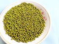 Indian green mung beans on a plate, white background. Royalty Free Stock Photo