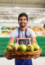 Grocery store employee offering apples from basket