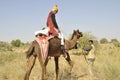 Indian groom on camel looking back