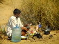 Indian guide cooking for tourists during camel safari