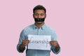 Indian guy silenced with mouth taped holding paper sheet with censorship word. Royalty Free Stock Photo