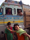 Indian Guy take action for a photo with a bus,Kolkata City, INDIA , 11th APRIL 2013