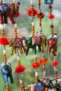 Handmade wind chimes with bells and small decorated toy elephant Royalty Free Stock Photo