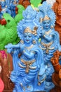 Indian handicraft statue of god Lord Krishna, many handmade colorful sculptures of Hindu god Royalty Free Stock Photo