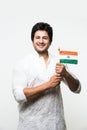 Indian handsome boy or man in white ethnic wear holding indian national flag and showing patriotism, standing isolated over white Royalty Free Stock Photo