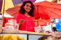 Indian happy woman salling spices in bazaar in Goa Royalty Free Stock Photo