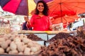 Indian happy woman salling spices in bazaar in Goa Royalty Free Stock Photo