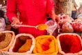 Indian happy woman salling spices in bazaar in Goa Royalty Free Stock Photo