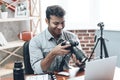 Indian Happy Young Man Photographer Work from Home Royalty Free Stock Photo