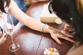 Indian henna tattoo artist drawing the uniqueness line art on the women hand