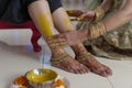 Indian Hindu Bride with turmeric paste with mother