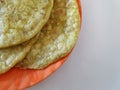 Group of Dal Holige or Obbatta in a Orange Color Plate on white Background