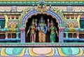 Indian Hindu god Balaji or Venkateswara and spouses statues on temple tower or gopuram