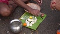 Indian Hindu people do faithful offer `Tarpan` to the divine for the liberation of the soul of their deceased elders at Mahalaya P