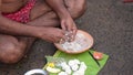 Indian Hindu people do faithful offer `Tarpan` to the divine for the liberation of the soul of their deceased elders at Mahalaya P