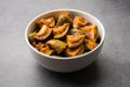 Indian Homemade Raw Mango Pickle or aam ka achar or Kairi Loncha in a bowl