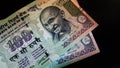 Indian hundred rupees two notes closeup collage on the floor Royalty Free Stock Photo