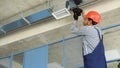 Indian hvac worker install ducted pipe system for ventilation and air conditioning