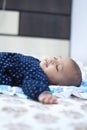 Indian Infant baby sleeping with toys