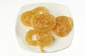 Indian Jalebi in white dish.