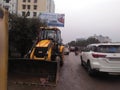 This is indian Jcb stand on frant saide on road picCity lucknow. So good and