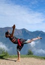 Indian Kalaripayattu fighter doing yoga exercices outdoors in Kerala, India