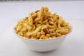 Indian khatta meetha mixture namkeen in white bowl image