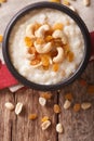 Indian kheer rice pudding with nuts and raisins close-up. Vertical top view