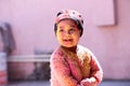 Indian Kid smiling portrait playing with colors on the occasion of holi Color of festival Royalty Free Stock Photo