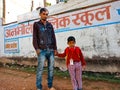 indian kid students coming school with elder brother on street in India January 2020