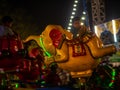 Indian kids enjoying carousel ride in elephant at amusement park Royalty Free Stock Photo