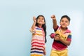 2 indian kids flying kite, one holding spindal or chakri Royalty Free Stock Photo