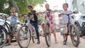 Indian kids ride cycle in colony