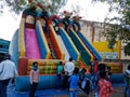 indian kids enjoying on slider at fair program in India January 2020 Royalty Free Stock Photo