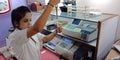 Indian lab technician girl testing samples at laboratory