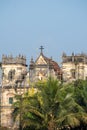 Indian labourers working on the repair and restoration of the ancient Portuguese era Church and