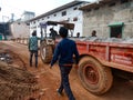 indian labours pushing tractor on street in India January 2020