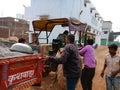 indian labours pushing tractor on street in India January 2020