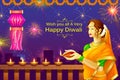 Indian lady with diya for Happy Diwali holiday of India