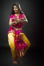 Indian lady performing traditional dance called Bharatnatyam