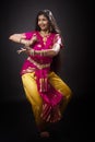 Indian lady performing traditional dance called Bharatnatyam