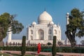 Indian lady in red sari in Taj Mahal, India, Agra