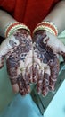 Indian lady showing her mehndi hands