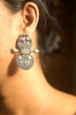 Indian lady wearing earring. India.
