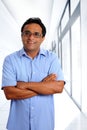 Indian latin businessman glasses in office