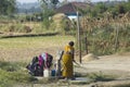 Indian Life: Pumping Water at the Well Royalty Free Stock Photo