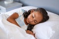 Indian little girl sleeping on bed Royalty Free Stock Photo