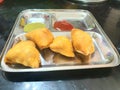 Indian local snacks samosa with sauce Chatni