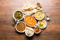 Indian lunch or dinner items like dal, paneer butter masala, roti, rice, salad Royalty Free Stock Photo